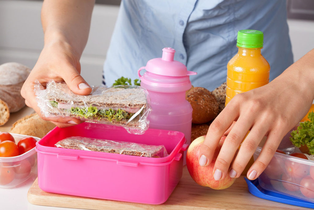 Mother preparing lunch box