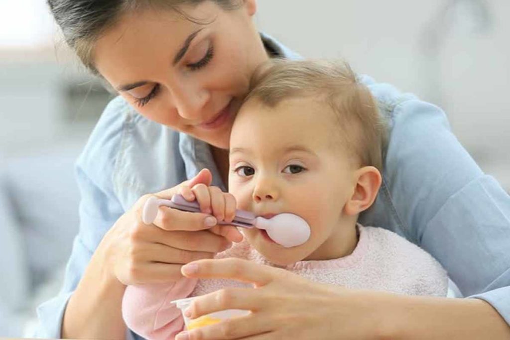mother-feding-food-to-child