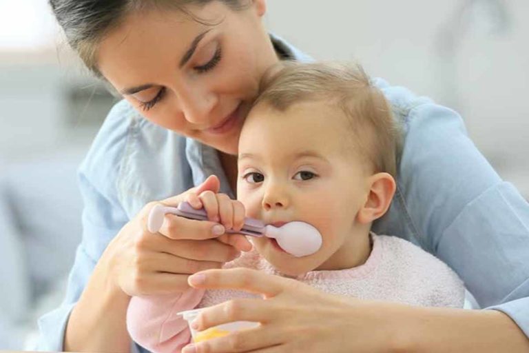 mother-feding-food-to-child